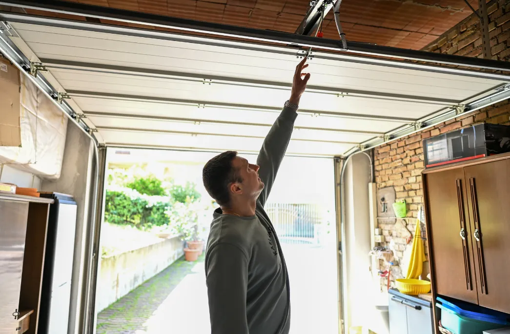 homeowner adjusting garage door