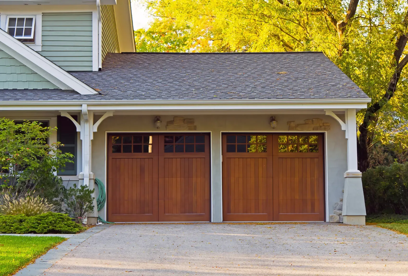 Wood carriage style garage door installation in Anderson, SC, an example of our Garage Doors & Custom Gates