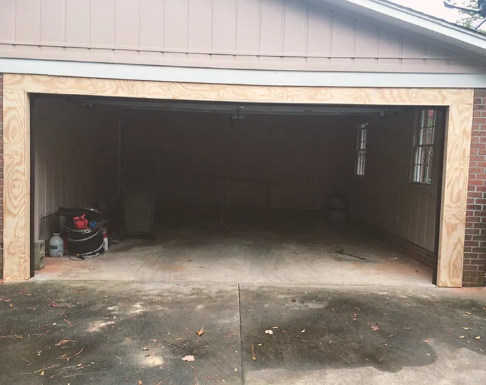 Door Tech technician at work on a garage door